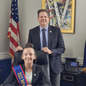 2023 NH Kid Governor Haydin Simmons, posing with Governor Chris Sununu.